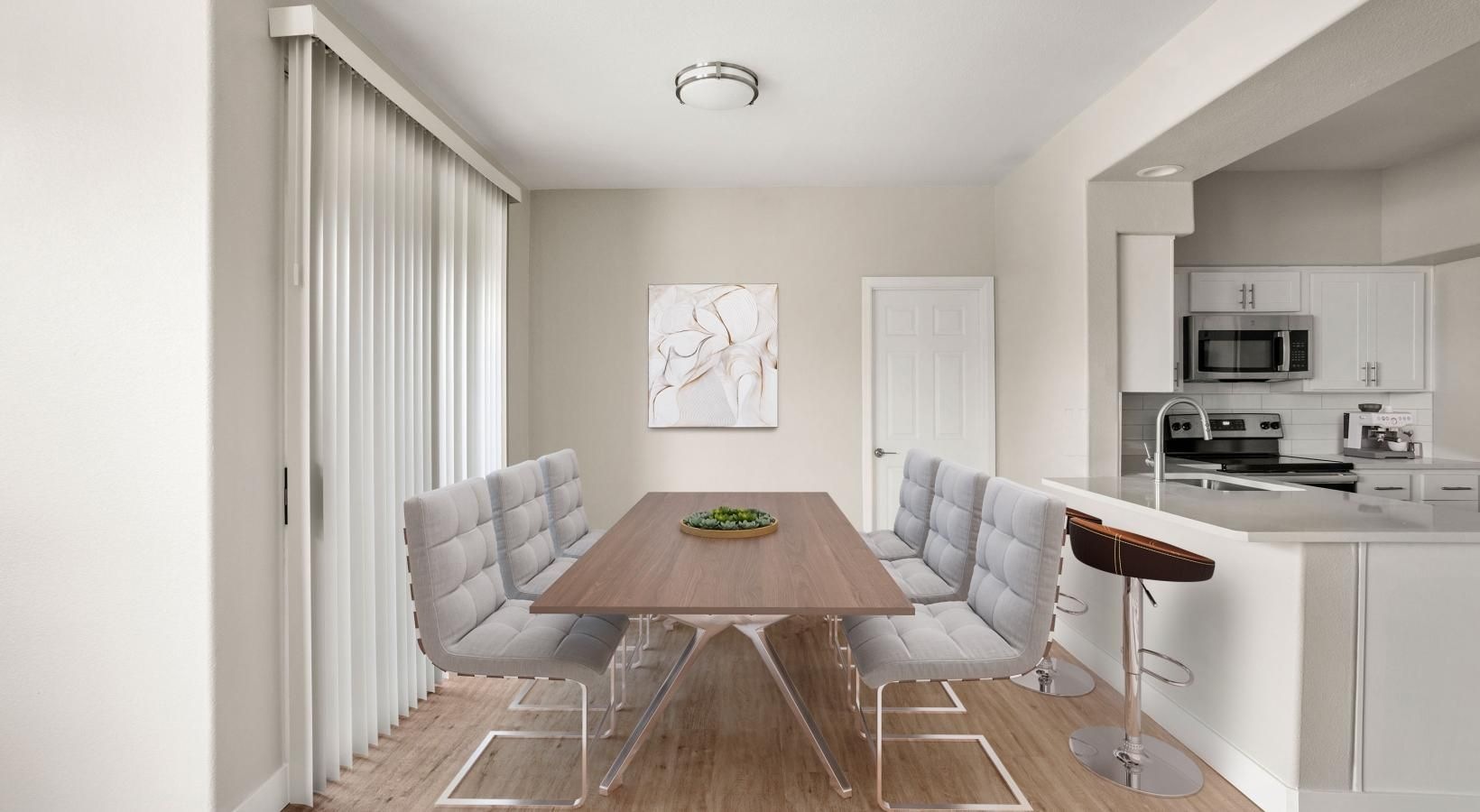 Wide open living areas perfect for entertaining a living room with a table and chairs