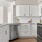 a kitchen with white cabinets