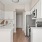 a kitchen with white cabinets