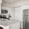 a kitchen with white cabinets