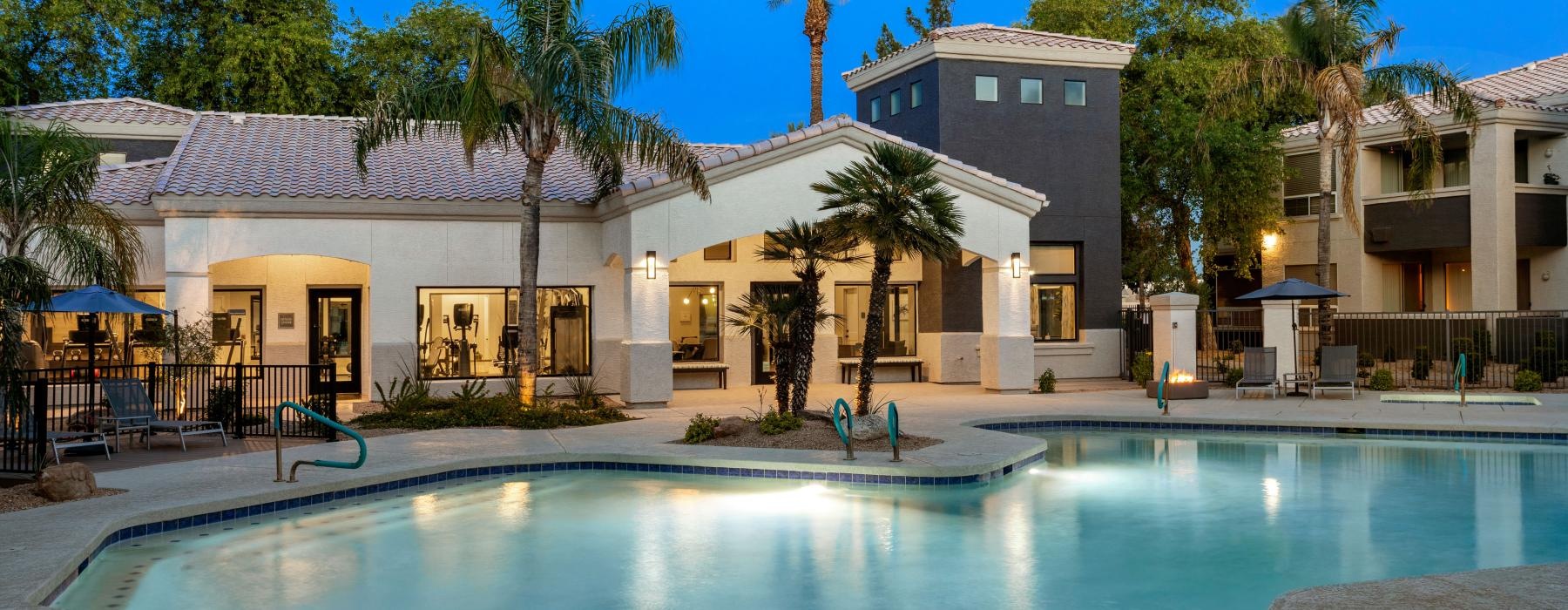 a swimming pool with a building in the background