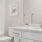 a bathroom with a tub sink and toilet