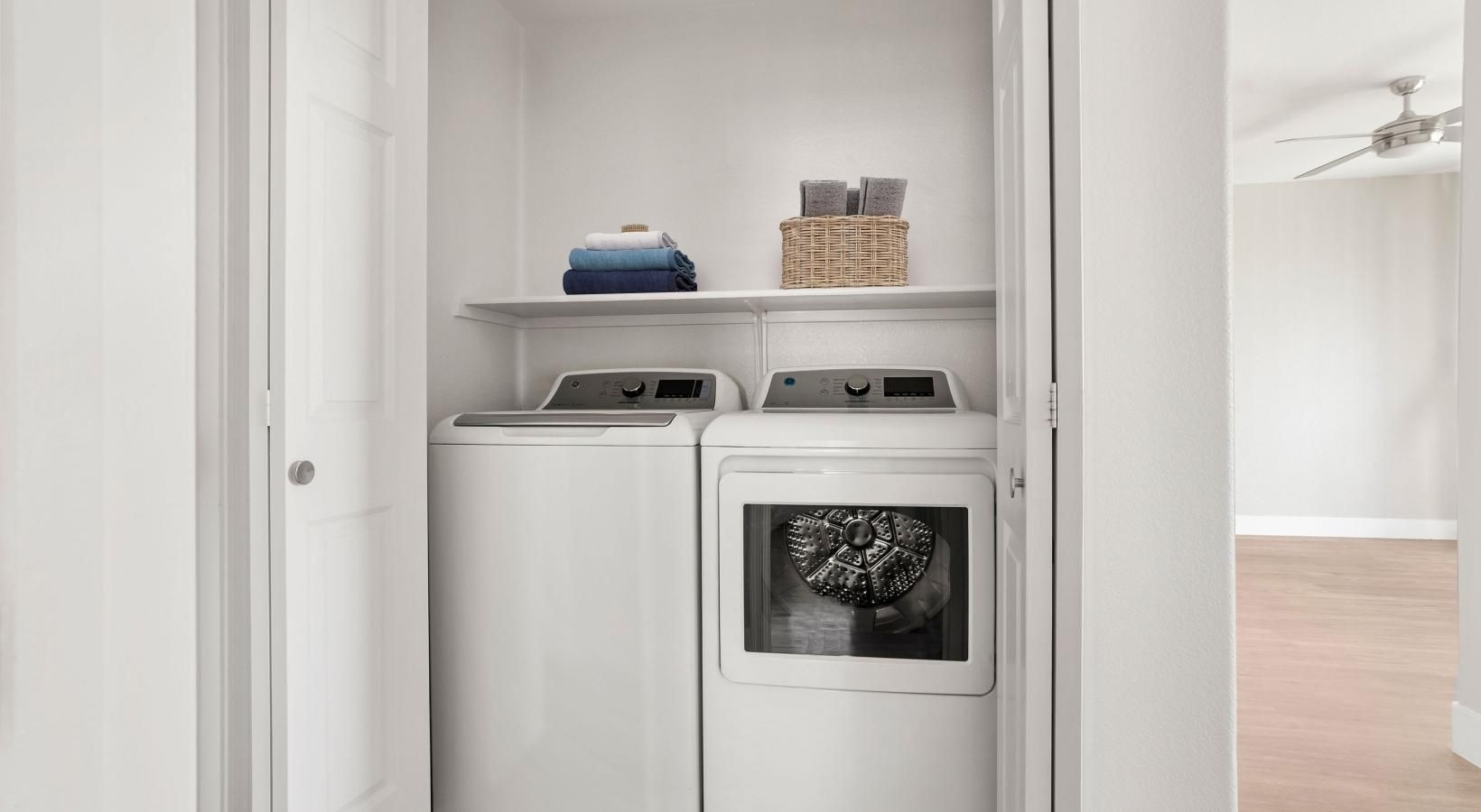 Laundry has never been easier a white kitchen with a white shelf