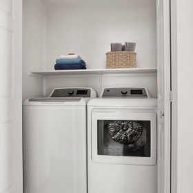 Laundry has never been easier a white kitchen with a white shelf