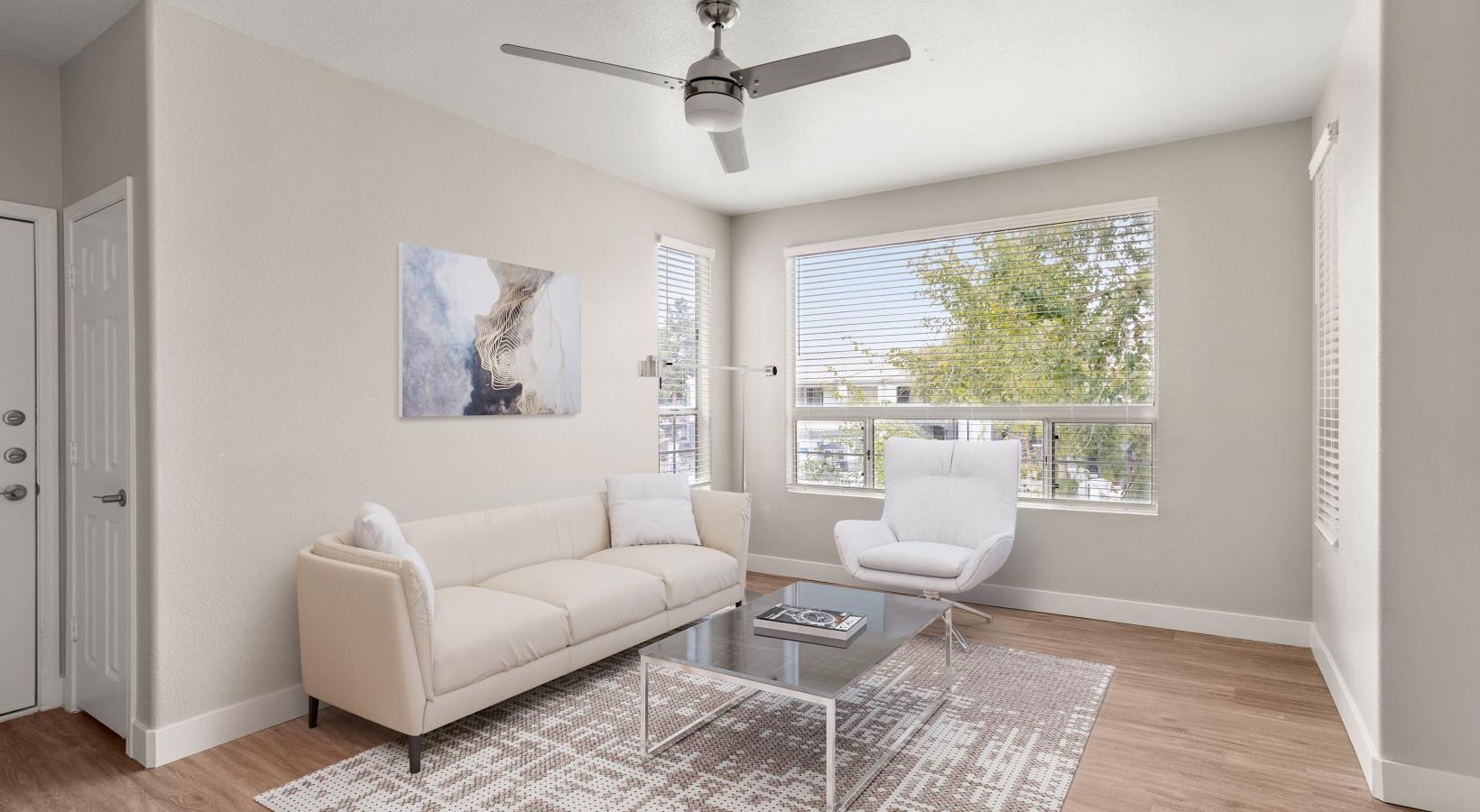 Generous living spaces to relax and unwind a living room with a white couch and a table
